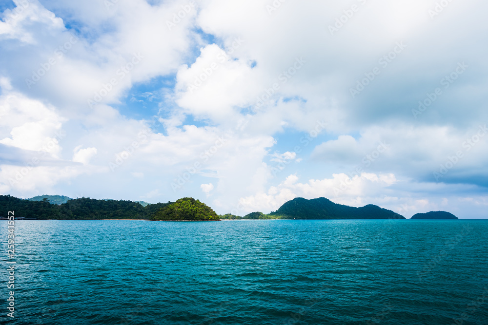 Sea and island on blue sky with cloud background