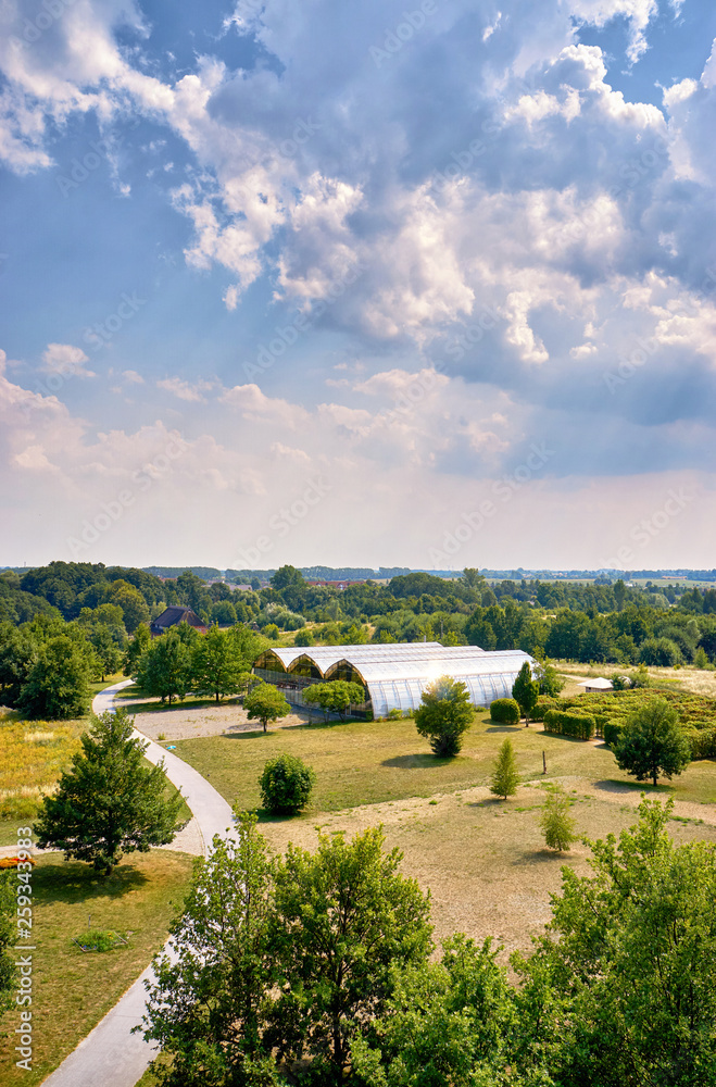 Fototapeta premium Park with modern large greenhouses in Wismar. Mecklenburg-Vorpommern, Germany