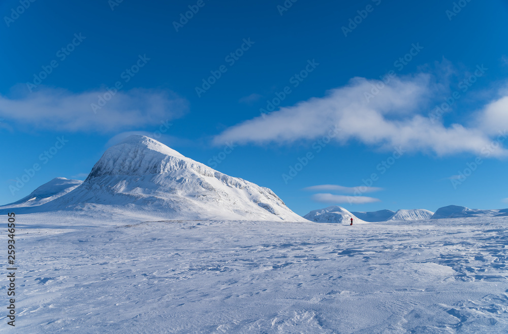 Silhouette of a lone cross country skier in national park Sarek. Lapland, Sweden.