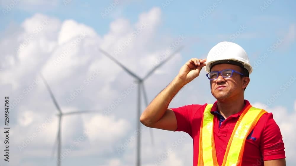 Electrical engineer man are standing monitoring of wind turbine footage slow motion Electrical engineer man are standing monitoring of wind turbine footage slow motion