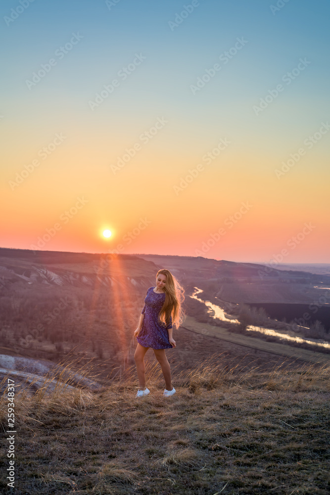the girl in the sunset. vertical image the girl in the sunset. vertical image