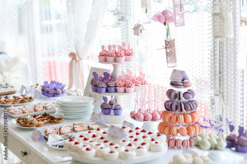 Table full with cakes and sweets at a wedding reception