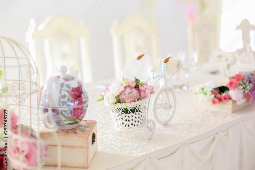 Flower and bicycle table decoration at a wedding reception Flower and bicycle table decoration at a wedding reception