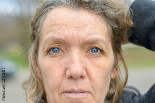 Face of middle aged woman with blue eyes