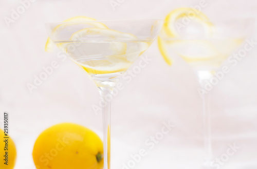 фотографія Vesper Cocktail in martini glass decoreted lemon rind - Image