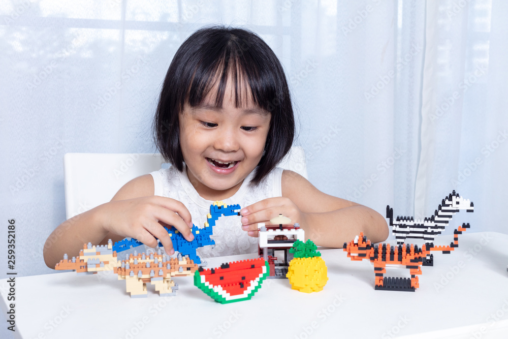 Asian Chinese little girl playing puzzle toys Asian Chinese little girl playing puzzle toys