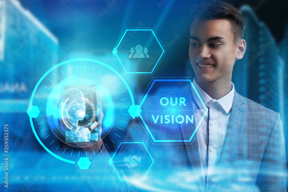 The concept of business, technology, the Internet and the network. A young entrepreneur working on a virtual screen of the future and sees the inscription: Our vision The concept of business, technology, the Internet and the network. A young entrepreneur working on a virtual screen of the future and sees the inscription: Our vision