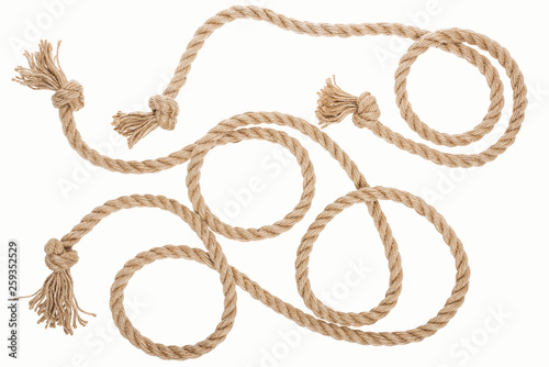 brown jute ropes with curls and knots isolated on white photo