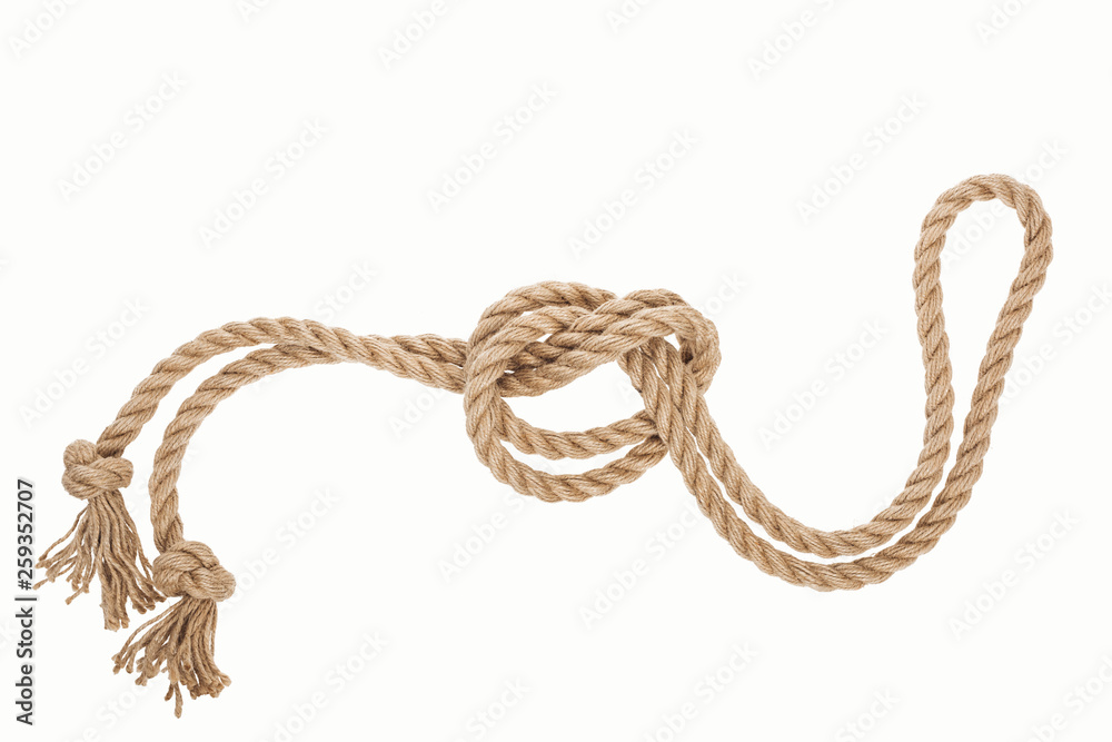 nautical jute rope with sea knot isolated on white nautical jute rope with sea knot isolated on white