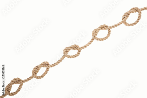 nautical brown rope with sailor knots isolated on white