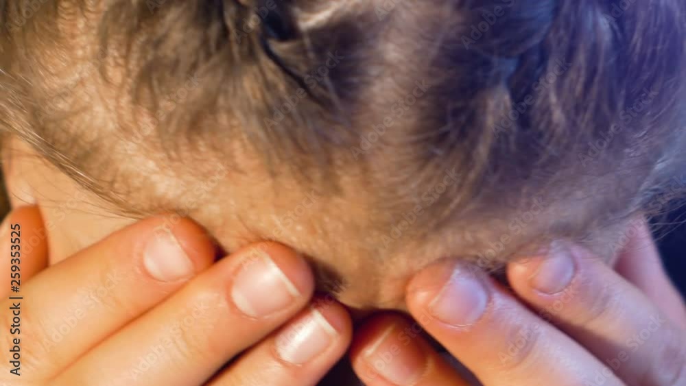 close up on face of a teenage girl with pigtails, desperate and crying close up on face of a teenage girl with pigtails, desperate and crying