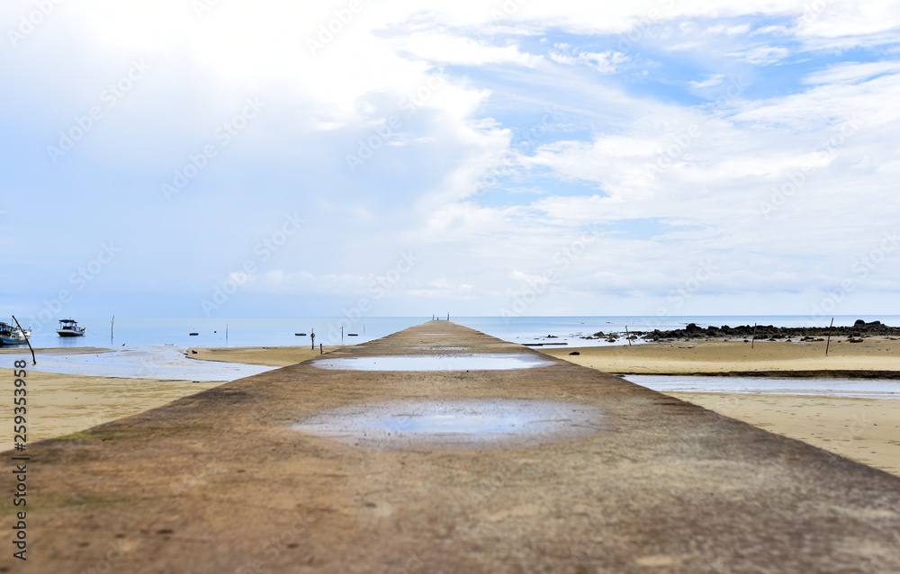 The long pier at Burung Mandi Beach, eastern side of Belitung Island, Indonesia