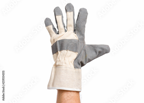 Worker showing gesture - open palm and five fingers. Male hand wearing working glove, isolated on white background. photo