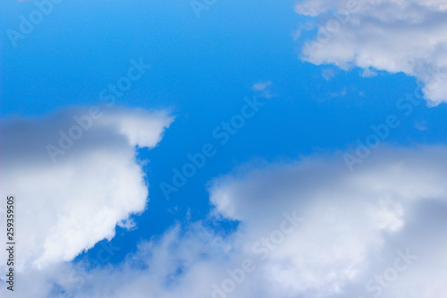 Beautiful Nature Background. Blue Sky And White Clouds Background With A Lot Of Copy Space For Text.