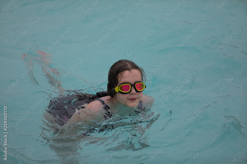 girl swimming in the pool