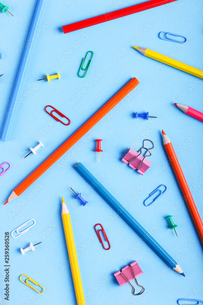 Colored pencils, paper clips and pins, pattern, copy space. Colored pencils, paper clips and pins, pattern, copy space.