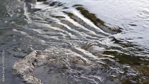 Mountain river water flowing over rocks