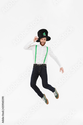 Full length of a cheerful young man celebrating