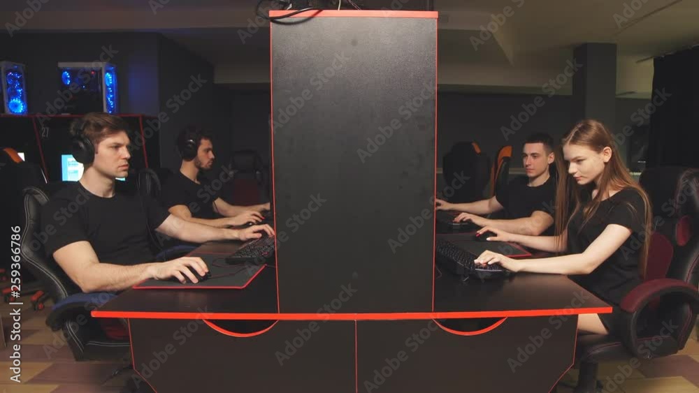 Team of eSport diverse gamers playing video games on a cyber game