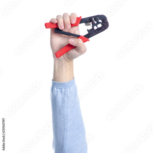 crimper in hand on white background isolation