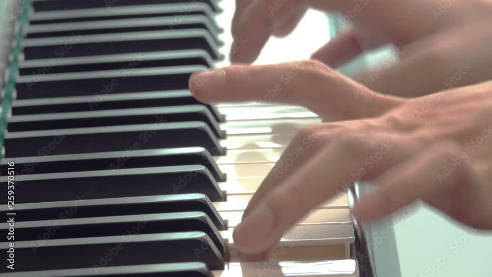 Close up hand of young men playing on piano Close up hand of young men playing on piano