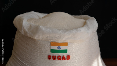 Sugar bag with India flag. Indian Sugar Manufacturers and Market. The production, processing and marketing of sugars photo