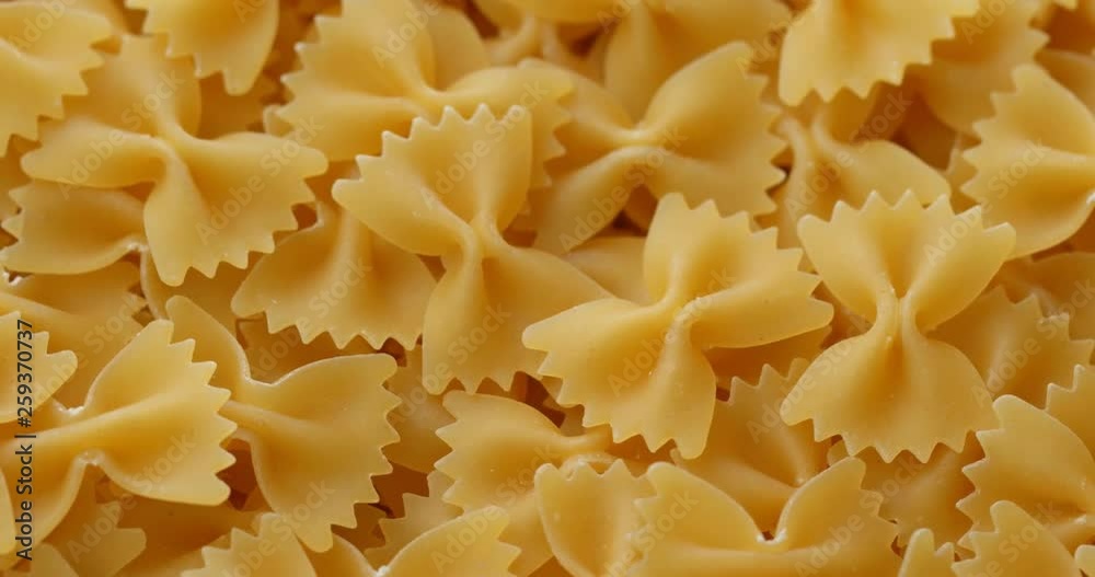 Pile of Dry uncooked farfalle Pile of Dry uncooked farfalle