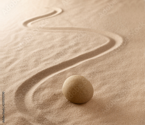 Zen stone meditation sand garden. Mindfulness, yoga or spa wellness background.