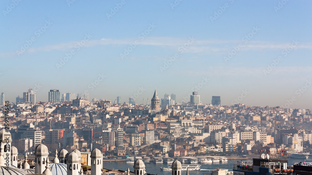 The view of the city of Istanbul. The roof of the mosque in the foreground. Greeting card with the Muslim holiday Ramadan Kareem. 