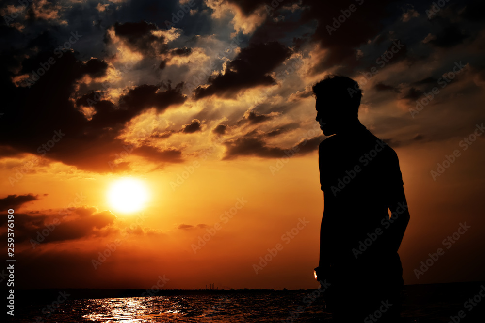 silhouette of a man at sunset