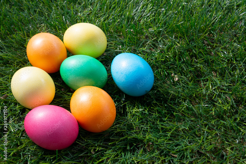 Painted Easter eggs on green grass