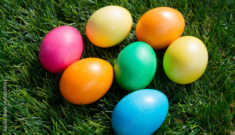 Painted Easter eggs on green grass