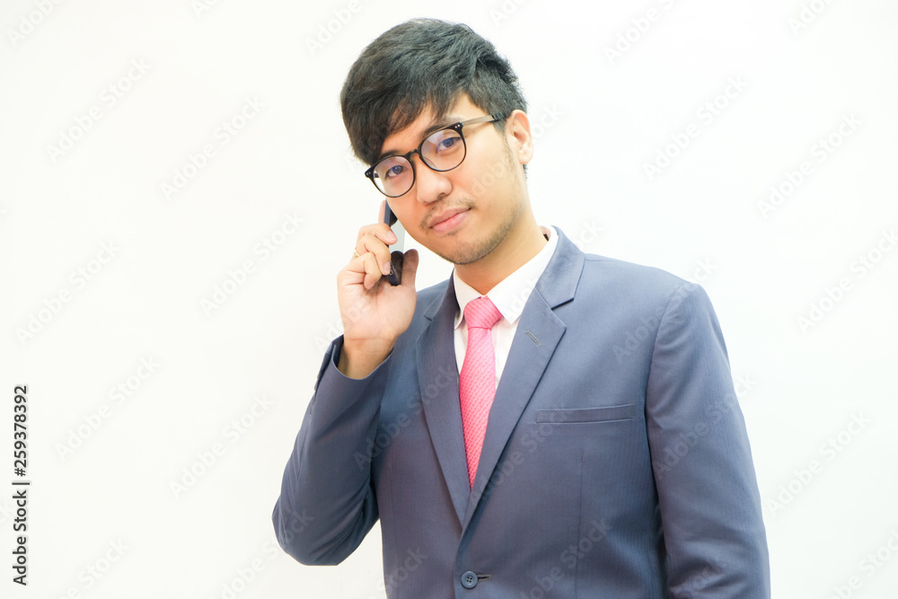 Business asian men use samrtphone in suit cloth with tie Business asian men use samrtphone in suit cloth with tie