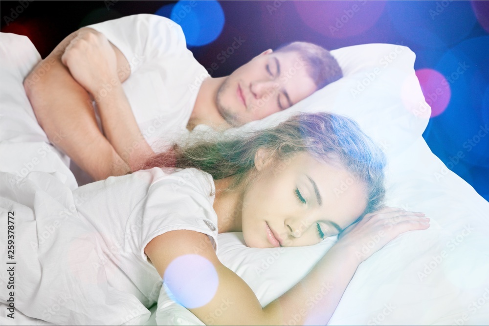 Beautiful sleeping woman in white bed with flares Beautiful sleeping woman in white bed with flares