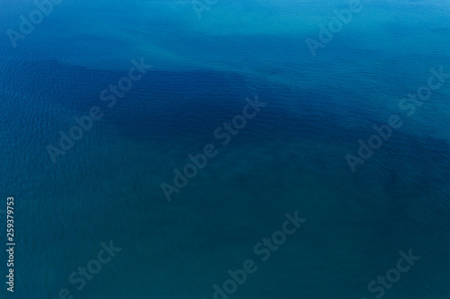 Aerial top view of Blue ocean surface background
