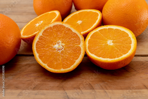 Oranges on a wooden table.