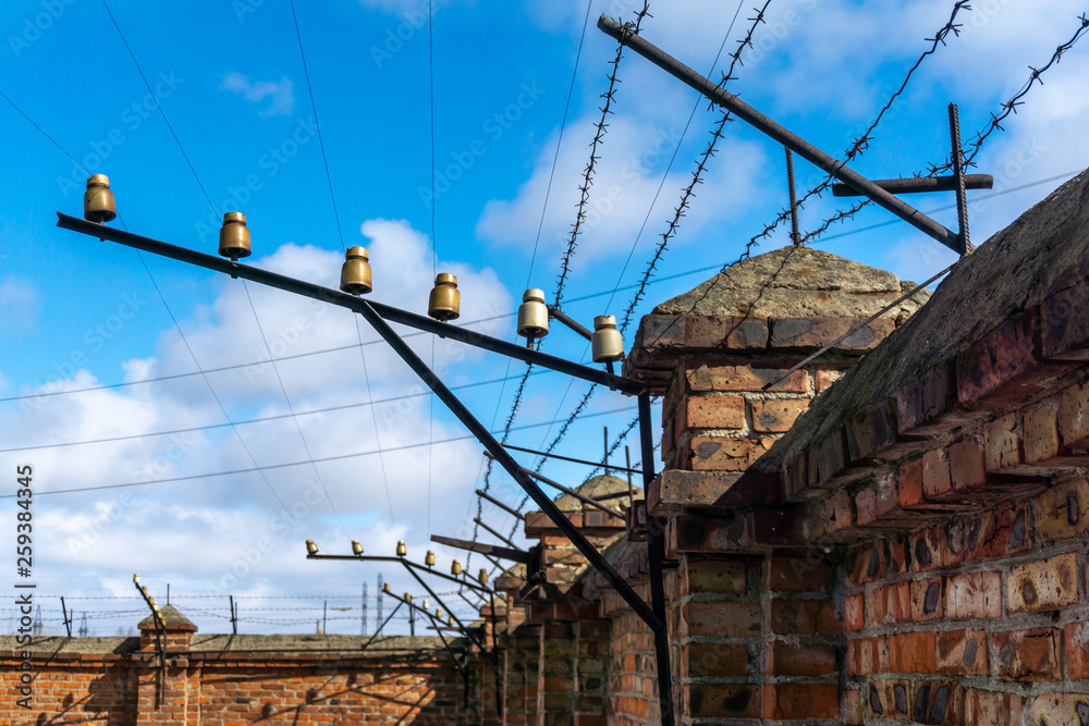Fototapeta premium Brick fence with barbed wire.