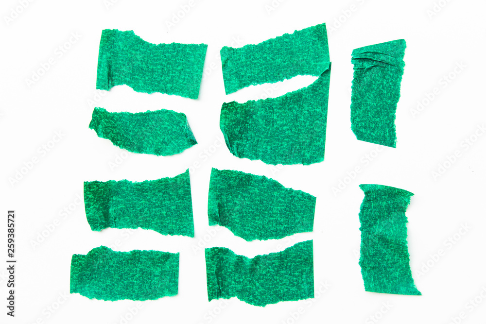 Set of green tapes on white background. Torn horizontal and different size green sticky tape, adhesive pieces. Set of green tapes on white background. Torn horizontal and different size green sticky tape, adhesive pieces.