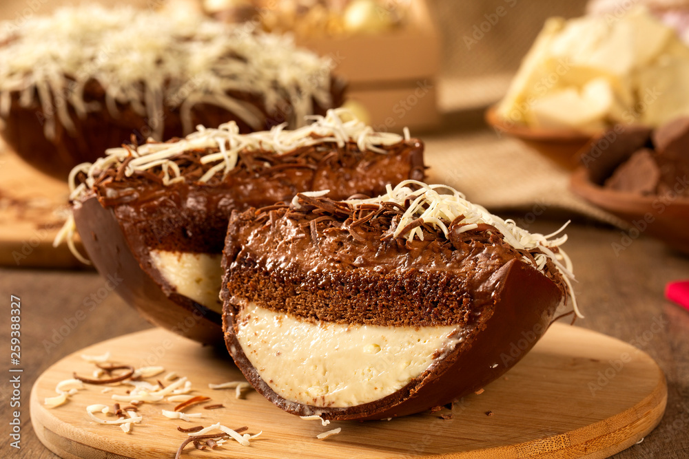 Gourmet easter egg, stuffed with cream and chocolate. Easter egg with pudding cream, Easter dessert. Easter concept. Gourmet easter egg, stuffed with cream and chocolate. Easter egg with pudding cream, Easter dessert. Easter concept.