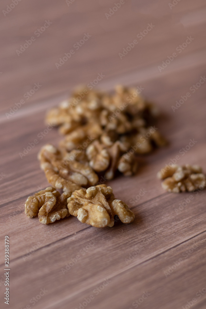 Healthy peeled walnuts and arranged on rustic-looking wood Healthy peeled walnuts and arranged on rustic-looking wood