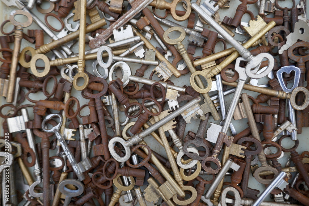 Many different old, rusty keys to sell at the flea market. Close up, background and texture Many different old, rusty keys to sell at the flea market. Close up, background and texture