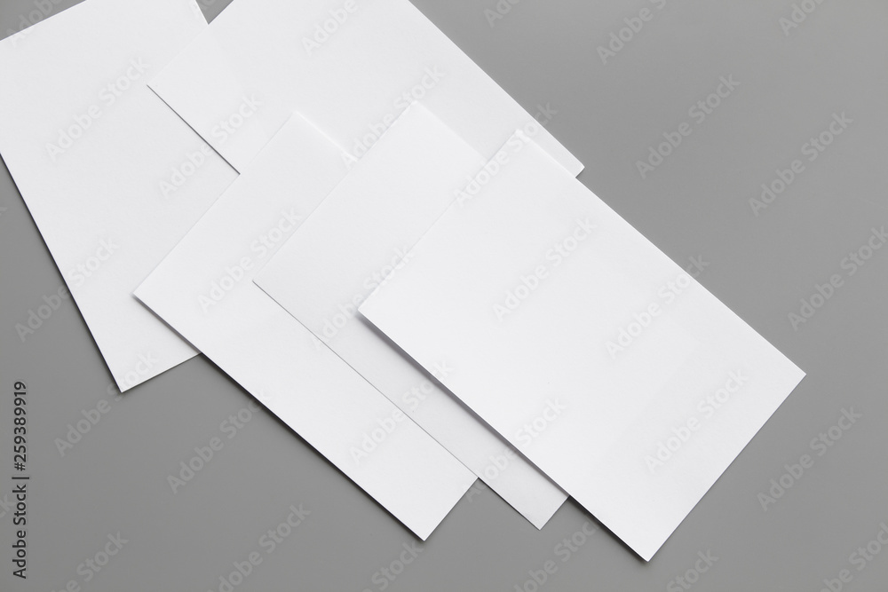 Blank portrait mock-up paper. brochure magazine isolated on gray, changeable background / white paper isolated on gray Blank portrait mock-up paper. brochure magazine isolated on gray, changeable background / white paper isolated on gray