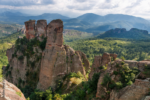 Belogradchik rocks during summer, with trees surrounding the stunning rock formations.