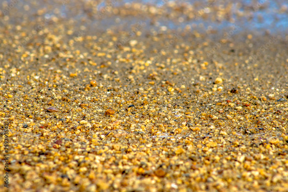 Sand and waves in beach with selective focus Sand and waves in beach with selective focus