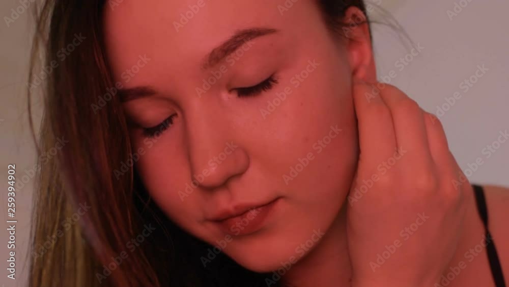 Beautiful girl puts on pearl earrings. Going to an evening event. Beautiful girl puts on pearl earrings. Going to an evening event.