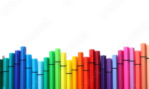 Many colorful markers on white background, top view. Rainbow palette