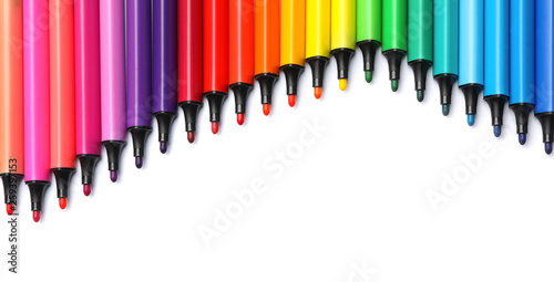 Many colorful markers on white background  top view. Rainbow palette