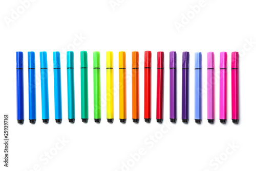 Many colorful markers on white background  top view. Rainbow palette