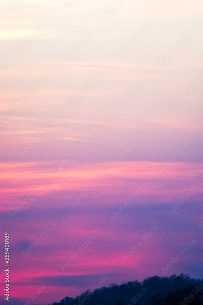 sky and clouds over hills at sunset