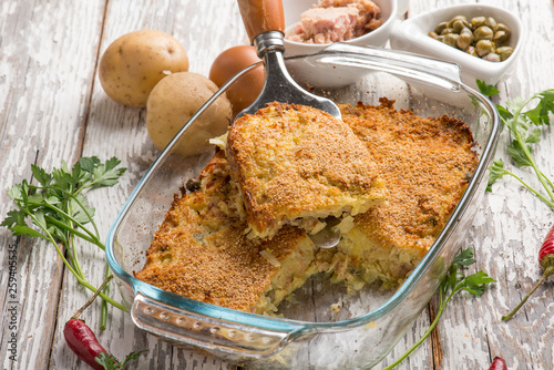 potato cake with tuna capers and hot chili pepper photo